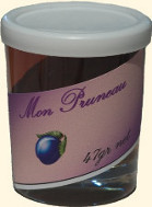 Dried prunes (pruneaux) in a small jar.